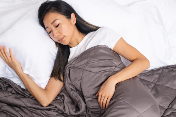 woman using weighted blanket in singapore